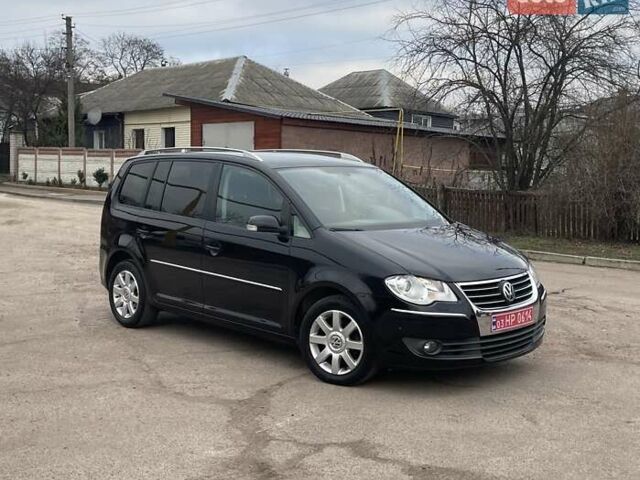 Черный Фольксваген Туран, объемом двигателя 1.4 л и пробегом 194 тыс. км за 6555 $, фото 179 на Automoto.ua