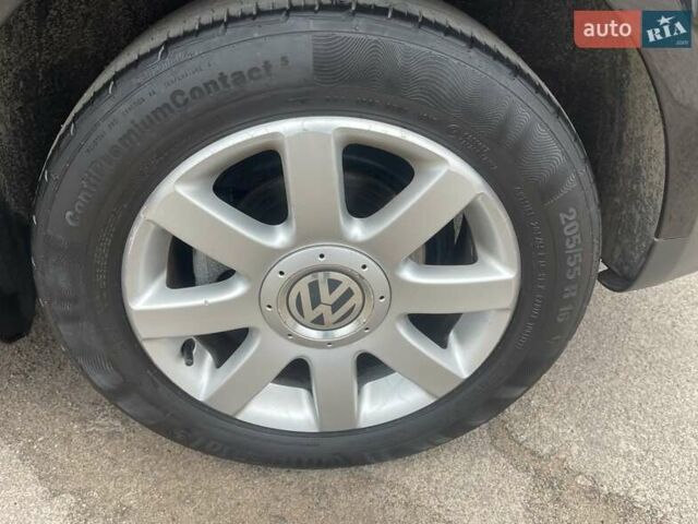 Черный Фольксваген Туран, объемом двигателя 1.4 л и пробегом 194 тыс. км за 6555 $, фото 24 на Automoto.ua