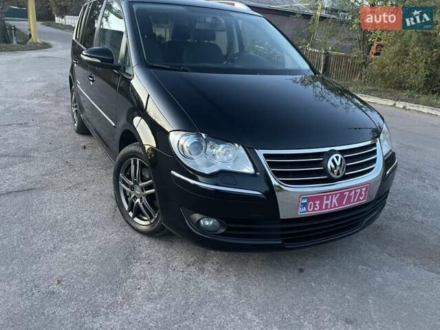 Черный Фольксваген Туран, объемом двигателя 1.4 л и пробегом 238 тыс. км за 7888 $, фото 194 на Automoto.ua