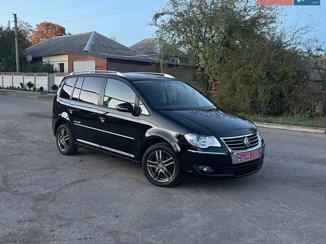 Черный Фольксваген Туран, объемом двигателя 1.4 л и пробегом 238 тыс. км за 7888 $, фото 197 на Automoto.ua