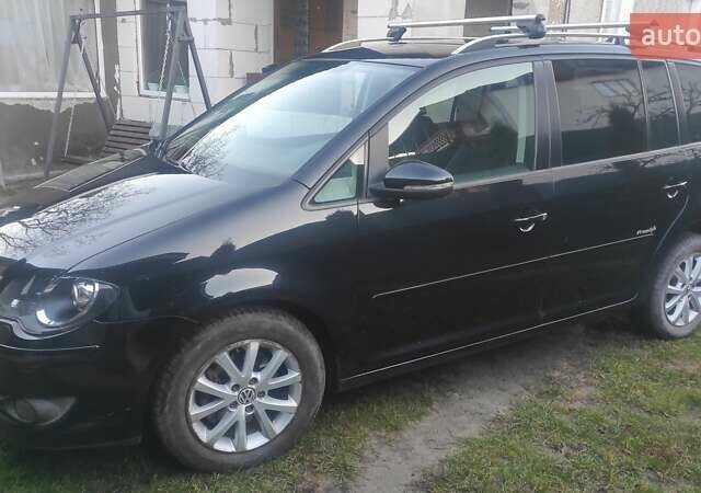 Черный Фольксваген Туран, объемом двигателя 1.39 л и пробегом 207 тыс. км за 7788 $, фото 3 на Automoto.ua