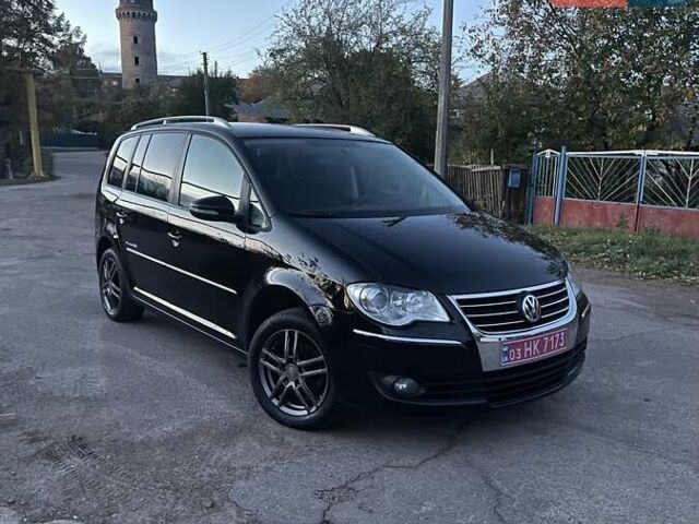 Черный Фольксваген Туран, объемом двигателя 1.4 л и пробегом 238 тыс. км за 7888 $, фото 4 на Automoto.ua