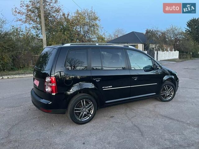 Черный Фольксваген Туран, объемом двигателя 1.4 л и пробегом 238 тыс. км за 7888 $, фото 201 на Automoto.ua