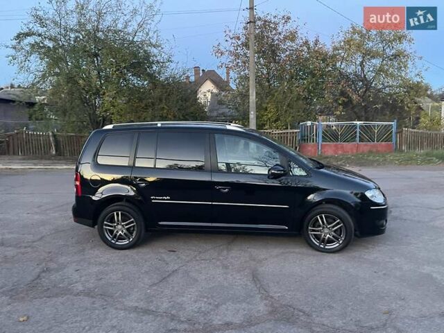 Черный Фольксваген Туран, объемом двигателя 1.4 л и пробегом 238 тыс. км за 7888 $, фото 199 на Automoto.ua