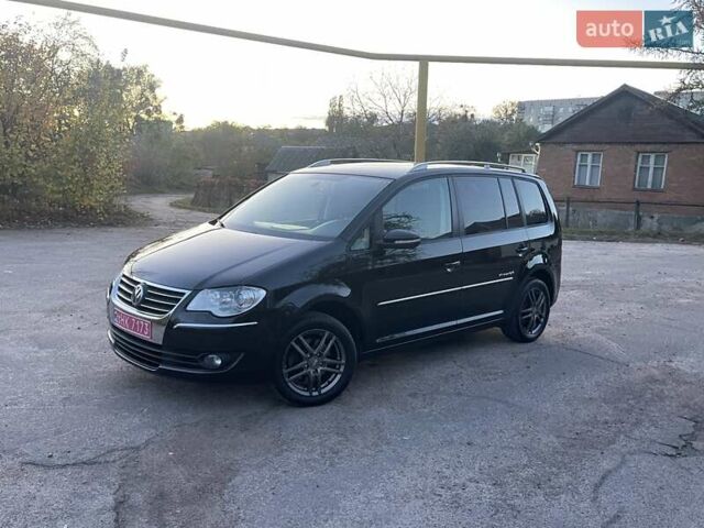 Черный Фольксваген Туран, объемом двигателя 1.4 л и пробегом 238 тыс. км за 7888 $, фото 109 на Automoto.ua