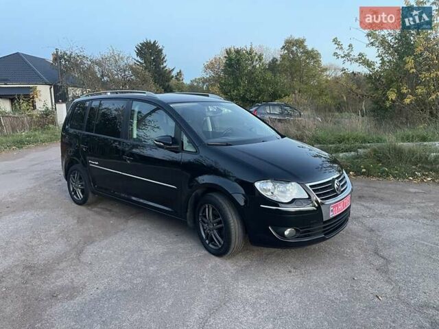 Черный Фольксваген Туран, объемом двигателя 1.4 л и пробегом 238 тыс. км за 7888 $, фото 104 на Automoto.ua