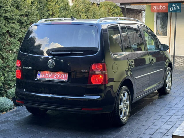 Черный Фольксваген Туран, объемом двигателя 1.4 л и пробегом 199 тыс. км за 7999 $, фото 4 на Automoto.ua