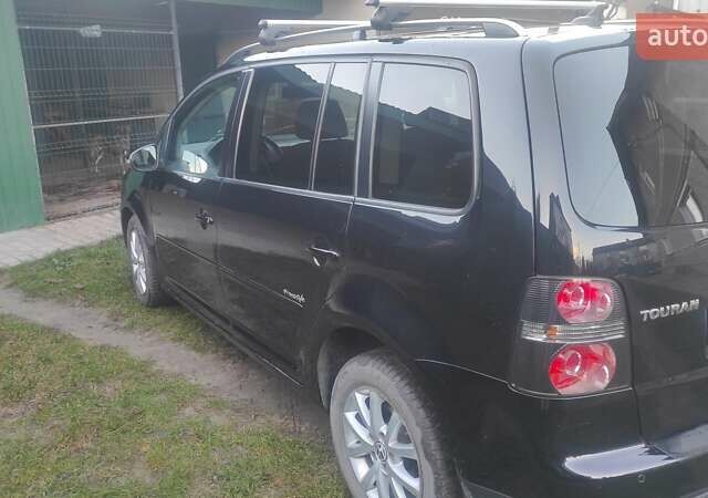 Черный Фольксваген Туран, объемом двигателя 1.39 л и пробегом 207 тыс. км за 7788 $, фото 4 на Automoto.ua