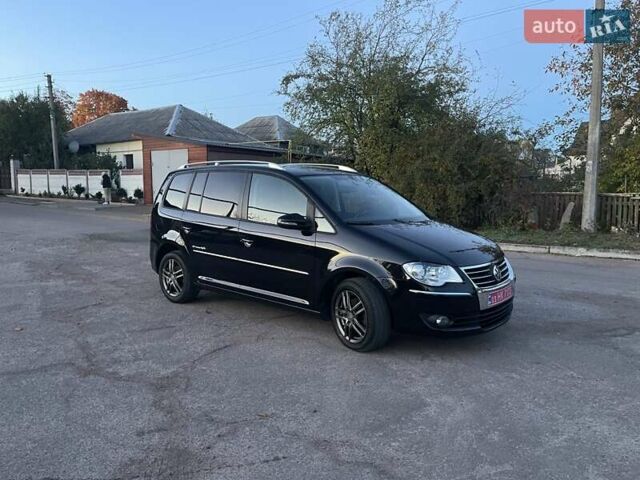 Черный Фольксваген Туран, объемом двигателя 1.4 л и пробегом 238 тыс. км за 7888 $, фото 203 на Automoto.ua