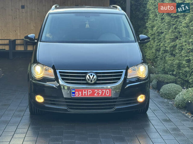 Черный Фольксваген Туран, объемом двигателя 1.4 л и пробегом 199 тыс. км за 7999 $, фото 1 на Automoto.ua