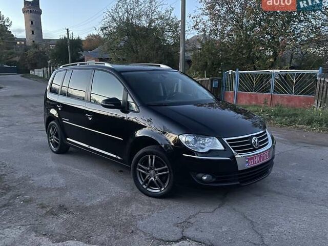 Черный Фольксваген Туран, объемом двигателя 1.4 л и пробегом 238 тыс. км за 7888 $, фото 2 на Automoto.ua