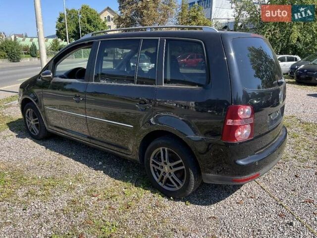 Черный Фольксваген Туран, объемом двигателя 1.4 л и пробегом 238 тыс. км за 7888 $, фото 262 на Automoto.ua