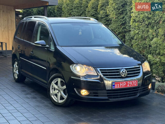 Черный Фольксваген Туран, объемом двигателя 1.4 л и пробегом 199 тыс. км за 7999 $, фото 2 на Automoto.ua