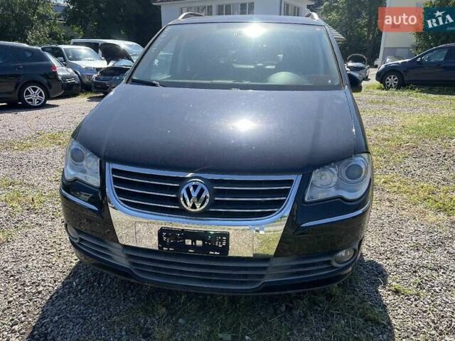 Черный Фольксваген Туран, объемом двигателя 1.4 л и пробегом 238 тыс. км за 7888 $, фото 260 на Automoto.ua