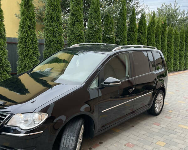 Чорний Фольксваген Туран, об'ємом двигуна 2 л та пробігом 205 тис. км за 7900 $, фото 5 на Automoto.ua