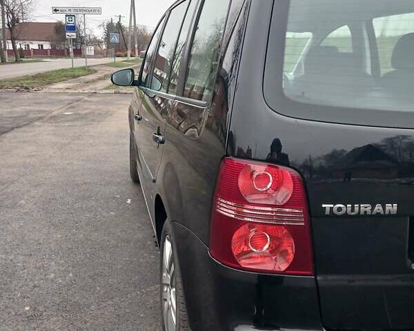 Черный Фольксваген Туран, объемом двигателя 1.6 л и пробегом 249 тыс. км за 7999 $, фото 47 на Automoto.ua