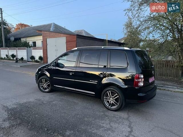 Черный Фольксваген Туран, объемом двигателя 1.4 л и пробегом 238 тыс. км за 7888 $, фото 217 на Automoto.ua