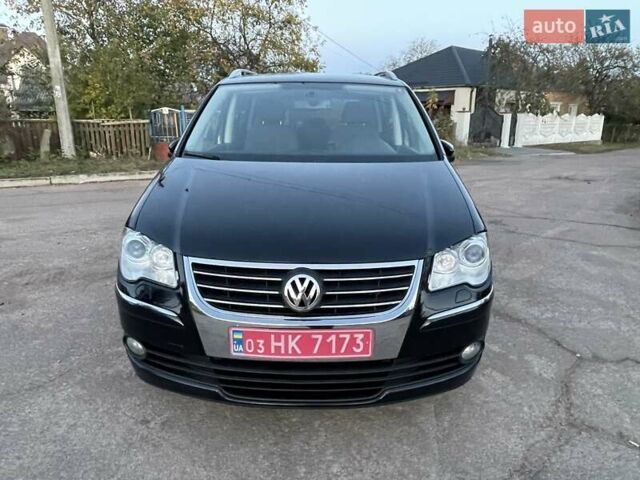 Черный Фольксваген Туран, объемом двигателя 1.4 л и пробегом 238 тыс. км за 7888 $, фото 88 на Automoto.ua