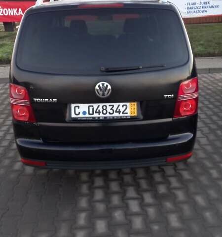 Черный Фольксваген Туран, объемом двигателя 1.9 л и пробегом 180 тыс. км за 11669 $, фото 1 на Automoto.ua