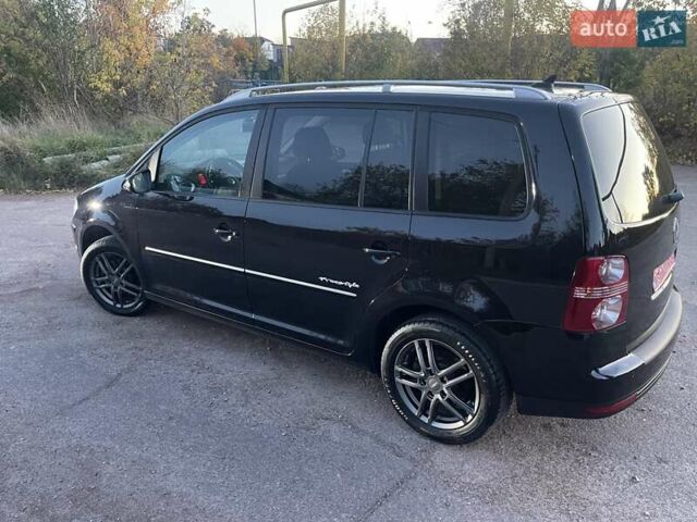 Черный Фольксваген Туран, объемом двигателя 1.4 л и пробегом 238 тыс. км за 7888 $, фото 117 на Automoto.ua