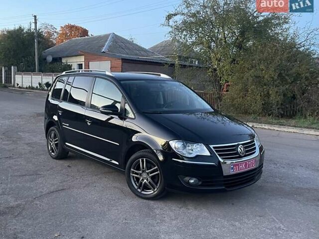 Черный Фольксваген Туран, объемом двигателя 1.4 л и пробегом 238 тыс. км за 7888 $, фото 192 на Automoto.ua
