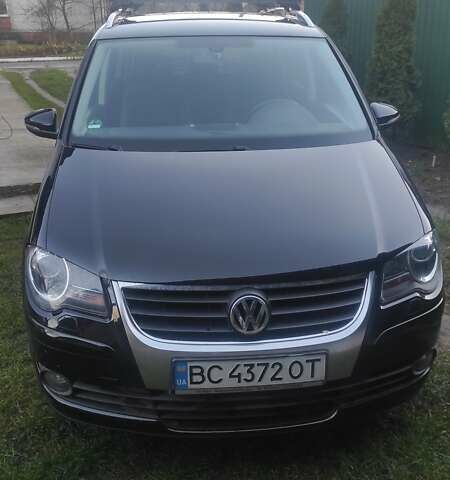 Черный Фольксваген Туран, объемом двигателя 1.39 л и пробегом 207 тыс. км за 7788 $, фото 1 на Automoto.ua
