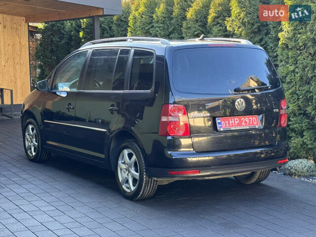 Черный Фольксваген Туран, объемом двигателя 1.4 л и пробегом 199 тыс. км за 7999 $, фото 7 на Automoto.ua
