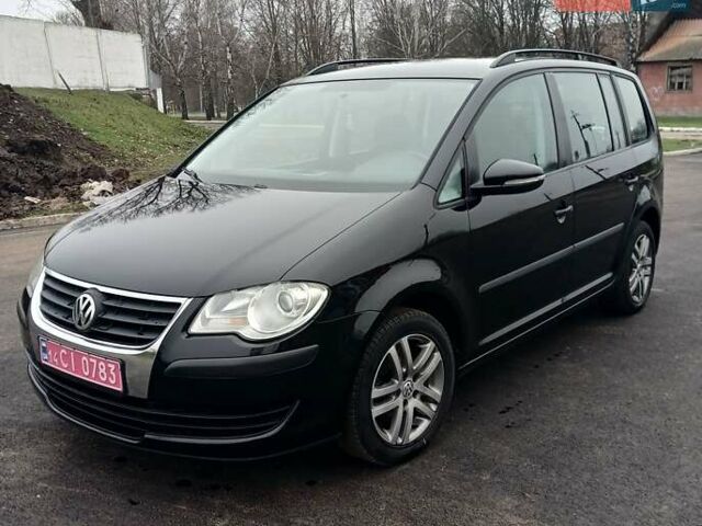 Черный Фольксваген Туран, объемом двигателя 1.6 л и пробегом 249 тыс. км за 7999 $, фото 5 на Automoto.ua