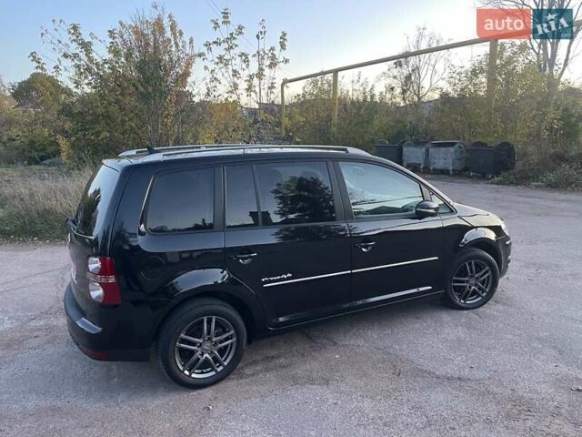 Черный Фольксваген Туран, объемом двигателя 1.4 л и пробегом 238 тыс. км за 7888 $, фото 98 на Automoto.ua