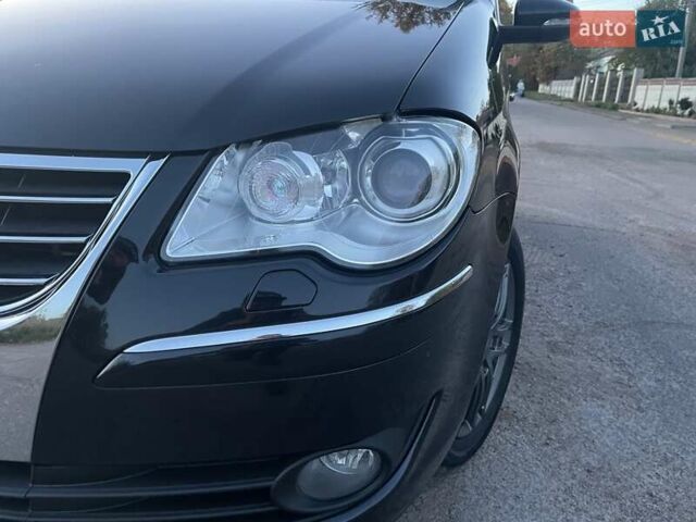 Черный Фольксваген Туран, объемом двигателя 1.4 л и пробегом 238 тыс. км за 7888 $, фото 112 на Automoto.ua