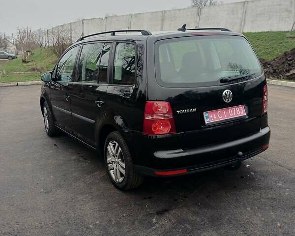 Черный Фольксваген Туран, объемом двигателя 1.6 л и пробегом 249 тыс. км за 7999 $, фото 15 на Automoto.ua