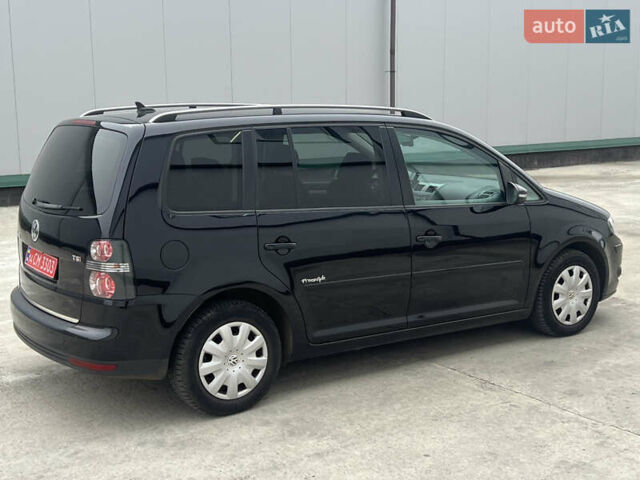 Черный Фольксваген Туран, объемом двигателя 1.4 л и пробегом 213 тыс. км за 8100 $, фото 2 на Automoto.ua