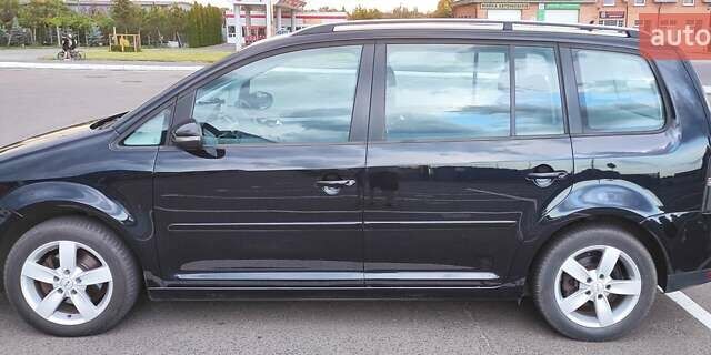 Черный Фольксваген Туран, объемом двигателя 1.39 л и пробегом 195 тыс. км за 8300 $, фото 1 на Automoto.ua