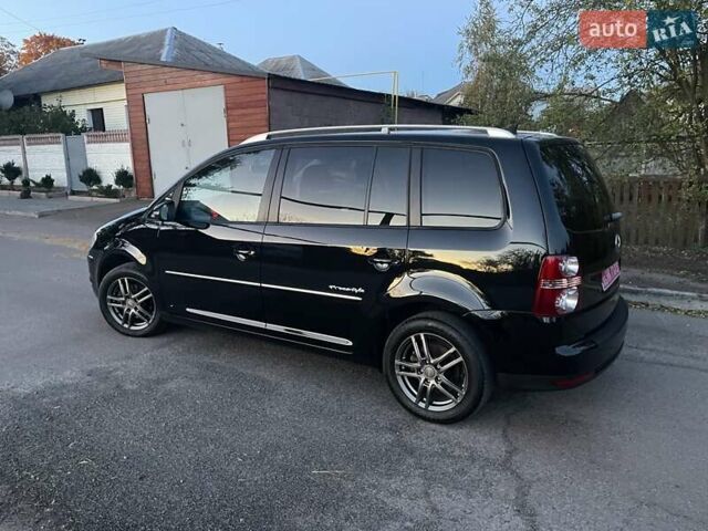 Черный Фольксваген Туран, объемом двигателя 1.4 л и пробегом 238 тыс. км за 7888 $, фото 214 на Automoto.ua