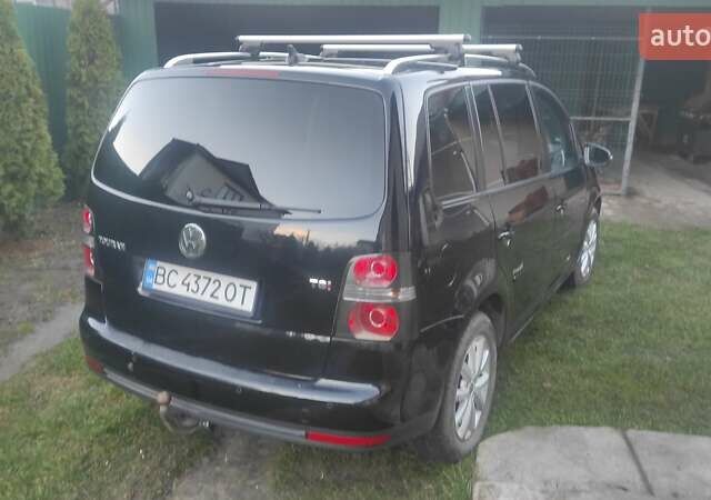 Черный Фольксваген Туран, объемом двигателя 1.39 л и пробегом 207 тыс. км за 7788 $, фото 6 на Automoto.ua