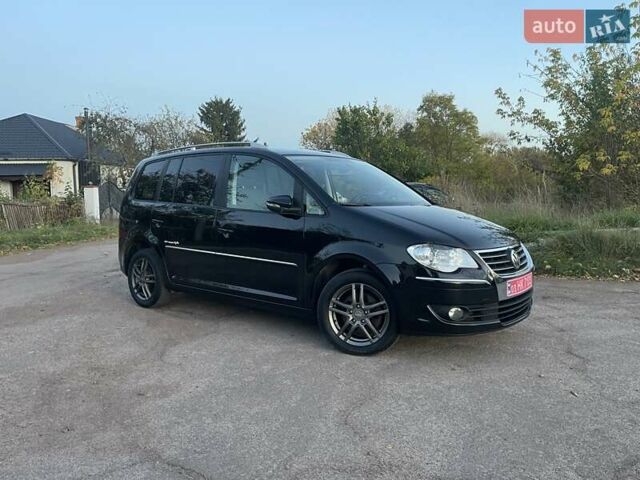 Черный Фольксваген Туран, объемом двигателя 1.4 л и пробегом 238 тыс. км за 7888 $, фото 91 на Automoto.ua