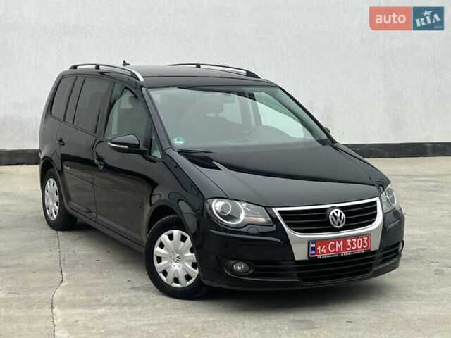 Черный Фольксваген Туран, объемом двигателя 1.4 л и пробегом 213 тыс. км за 8100 $, фото 1 на Automoto.ua