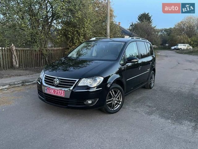 Черный Фольксваген Туран, объемом двигателя 1.4 л и пробегом 238 тыс. км за 7888 $, фото 207 на Automoto.ua