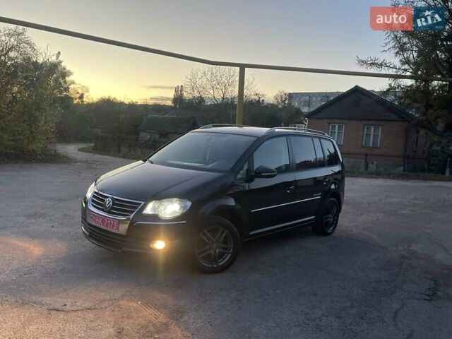 Черный Фольксваген Туран, объемом двигателя 1.4 л и пробегом 238 тыс. км за 7888 $, фото 106 на Automoto.ua