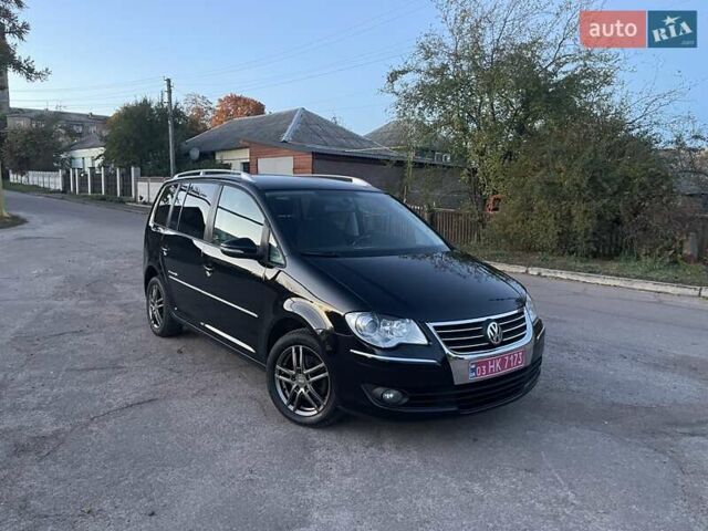 Черный Фольксваген Туран, объемом двигателя 1.4 л и пробегом 238 тыс. км за 7888 $, фото 198 на Automoto.ua