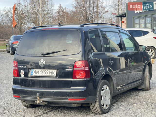 Черный Фольксваген Туран, объемом двигателя 1.4 л и пробегом 290 тыс. км за 6900 $, фото 2 на Automoto.ua