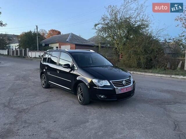 Черный Фольксваген Туран, объемом двигателя 1.4 л и пробегом 238 тыс. км за 7888 $, фото 204 на Automoto.ua