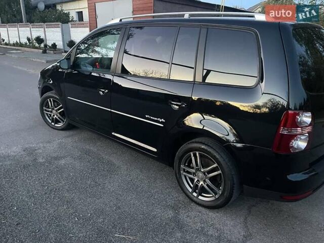 Черный Фольксваген Туран, объемом двигателя 1.4 л и пробегом 238 тыс. км за 7888 $, фото 216 на Automoto.ua