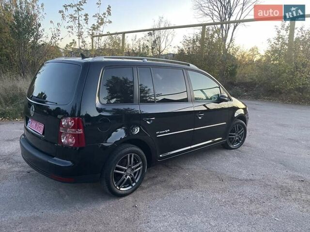 Черный Фольксваген Туран, объемом двигателя 1.4 л и пробегом 238 тыс. км за 7888 $, фото 102 на Automoto.ua