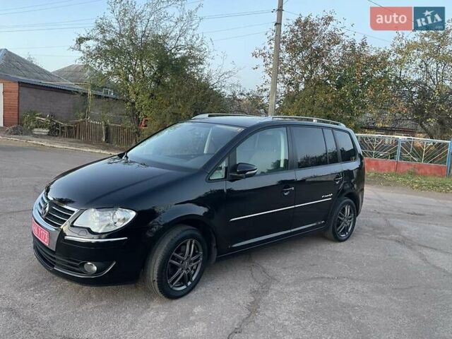 Черный Фольксваген Туран, объемом двигателя 1.4 л и пробегом 238 тыс. км за 7888 $, фото 86 на Automoto.ua