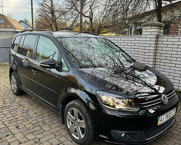 Черный Фольксваген Туран, объемом двигателя 1.39 л и пробегом 99 тыс. км за 11399 $, фото 1 на Automoto.ua