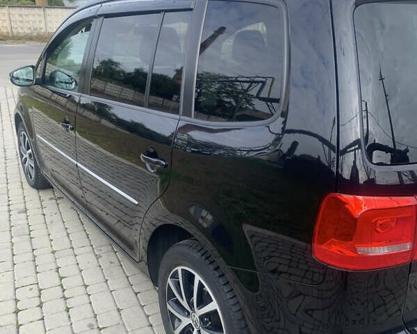 Черный Фольксваген Туран, объемом двигателя 1.97 л и пробегом 205 тыс. км за 12500 $, фото 4 на Automoto.ua