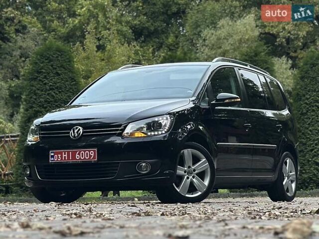 Черный Фольксваген Туран, объемом двигателя 2 л и пробегом 200 тыс. км за 11850 $, фото 1 на Automoto.ua