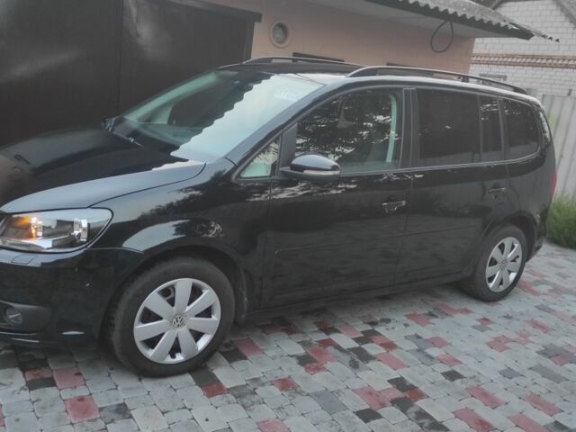 Черный Фольксваген Туран, объемом двигателя 2 л и пробегом 200 тыс. км за 12800 $, фото 1 на Automoto.ua