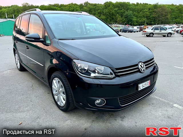 Черный Фольксваген Туран, объемом двигателя 2 л и пробегом 229 тыс. км за 12999 $, фото 1 на Automoto.ua